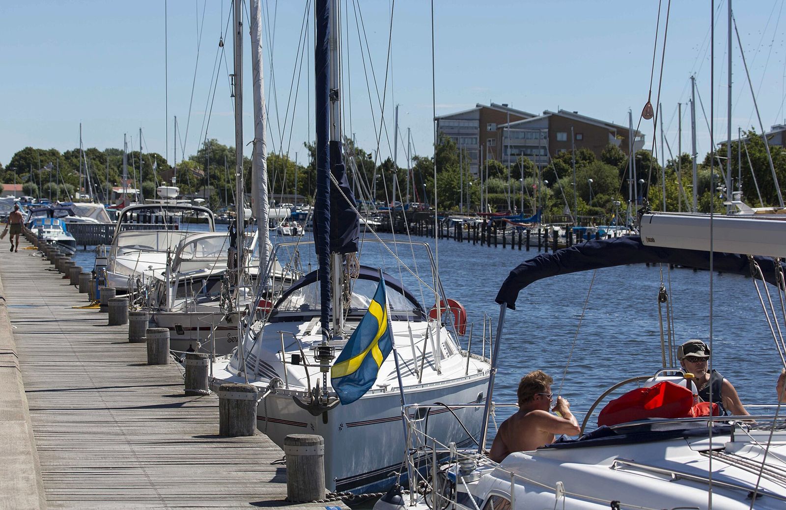 Boats and people in Lomma harbour on a summer day