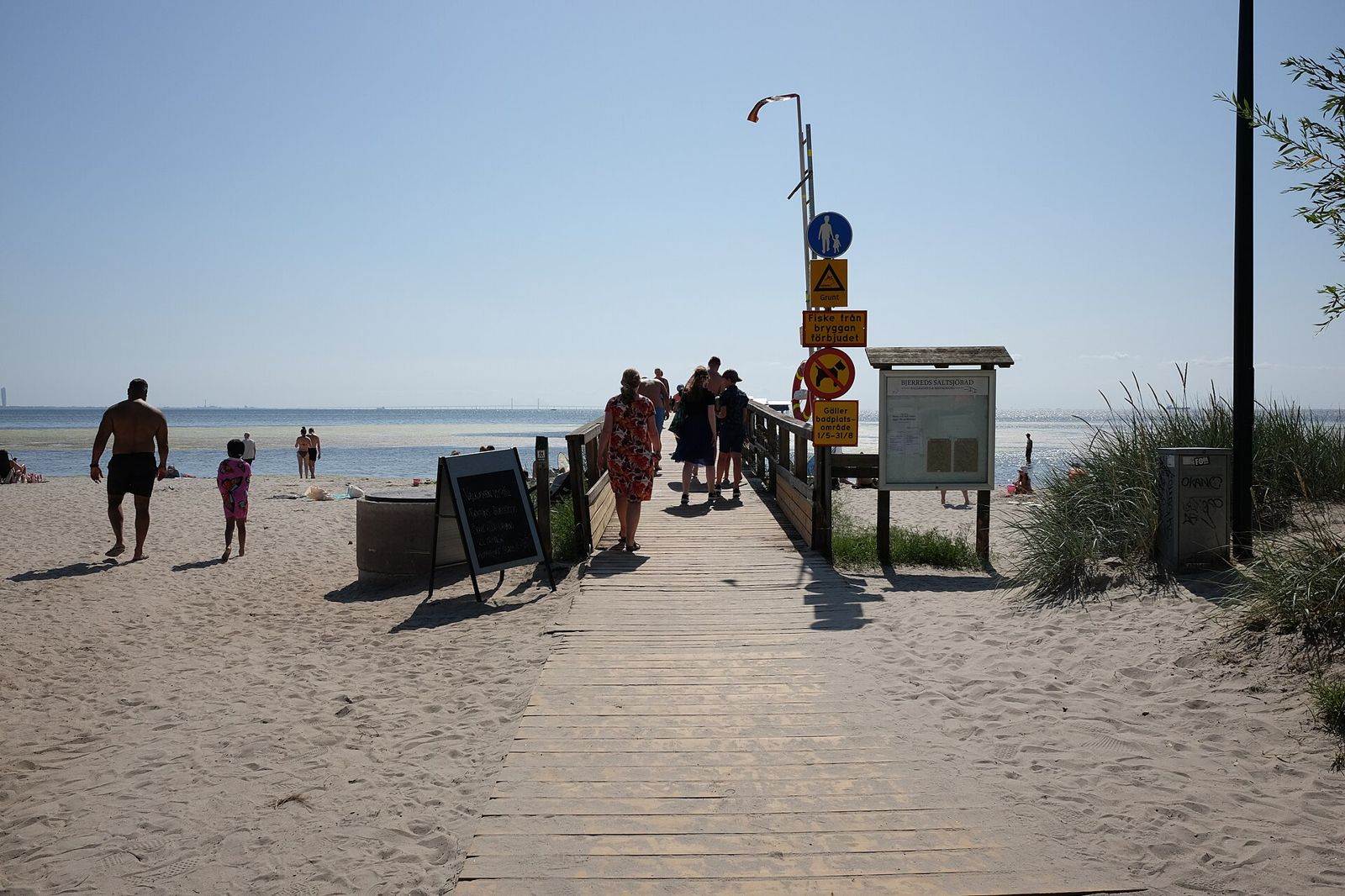 Walking out along Långa Bryggan towards the bath house
